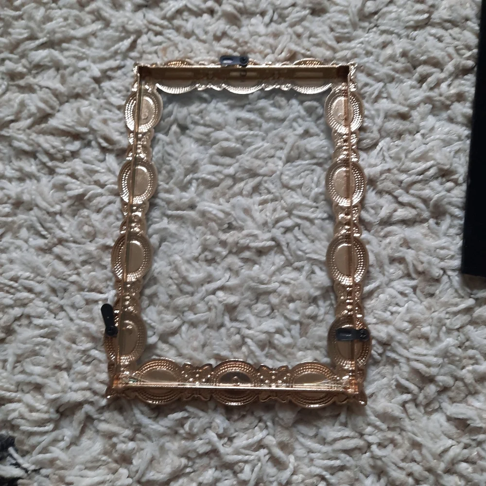 Gold tone metal picture frame